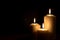 Christmas advent candle light in church with blurry golden bokeh for religious ritual, spiritual zen meditation, peaceful mind