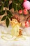 Christmas angel with a gift. Background bright lights bokeh New year, winter snow and souvenir, angel messenger of love and