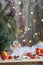 Christmas angel in tree and red candles on colorful background bokeh among Christmas and New Year decor