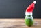 Christmas avocado. avocado in christmas hat. holidays concept