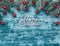 Christmas azure christmas background, fir branches with red globes. Space for text. Top view