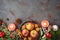 Christmas background with apples, walnuts and candles on stone tabletop. Holidays cooking and baking concept
