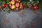 Christmas background with apples, walnuts and decorations on stone tabletop. Holidays cooking and baking concept