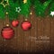 Christmas background with bauble, pine needles and wooden texture for greeting card and happy holiday