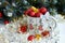 Christmas background with beautiful mug with gifts and balls in beautiful tinsel