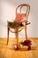 Christmas background with bentwood chair against blank wall backdrop.