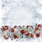 Christmas background with a border fir branches, red berries and balls on wooden boards