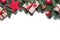 Christmas background border at the top with fir branches and other decorations presents red stars and bulbs with copy space on