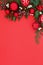 Christmas Background Border with Winter Greenery and Red Baubles