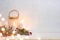 Christmas background, burning lantern candles decorated with frosted fir branches