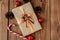 Christmas background with Christmas cones and toys, fir branches, giftboxes and decorations on a wooden table background