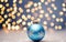 Christmas background. Coloful Christmas toys of de-focused lights. Space for text. Blue background.