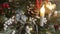 Christmas Background. Composition with green fir branches, electric burning candles, defocused cones and christmas ball