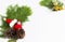 Christmas background decoration with fir tree pine cone, santa hat and gift festive on white background composition with border