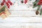 Christmas background with decorations and handmade gift boxes on white wooden board with snowflake.