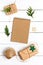 Christmas background with an empty Notepad, craft paper gift boxes and star decorations on a white wooden table