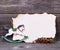 Christmas background with empty paper and wooden horse decoration and berries
