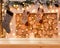 Christmas background. Empty wooden table on tthe background of a christmas fireplace with firewood, santa socks, golden bokeh,