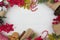 Christmas background with festive decorations on white wooden table. Top view with copy space