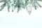Christmas background with fir tree branch, decorative glass lantern, stars, balls and pine cone