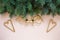 Christmas background with fir tree branches, Christmas decoration â€“  trumpets and Santa`s staff. Top view, close up