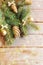 Christmas background with fir tree branches on wooden table