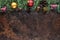 Christmas background with fir tree, red berries, pine cones, Christmas balls and other decor. Flat lay, top view with