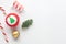 Christmas background with fir-tree, ribbons, christmas cane and candies.