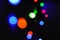 Christmas background, garland lights, glass ball, toys, glare night. New Year`s toys and ornaments background theme