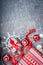 Christmas background with gift boxes, ribbons, paper snowflakes and red decorations