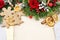 Christmas background with gingerbread cookies, fir wreath, dried fruits and vintage sheets of paper