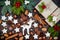 Christmas background with gingerbread cookies, presents, fir branches and spices on the old wooden board