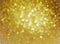 Christmas background. Gold Holiday Abstract Glitter Defocused Background. Blurry Bokeh.