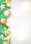 Christmas background with green branches and yellow ornaments