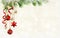 Christmas background with green pine twigs, hanging red decorations and silk twisted ribbons