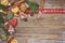 Christmas background. Homemade gingerbread cookies, cinnamon, Christmas tree on old wooden background. Toned, soft focus, copy spa