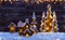 Christmas background with illuminated wooden village and trees