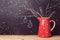 Christmas background with jug over chalkboard. Creative Christmas decorations. Alternative Christmas tree.