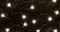 Christmas background made of lights, garlands in the form of stars in dark colors