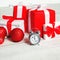 Christmas background, many decorated boxes gifts and alarm clock