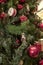 Christmas background from natural and artificial pine branches with old Christmas decorations, drums, statuettes, pine cones and r