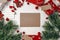 Christmas background with presents, coniferous branches and gingerbread cookie