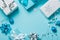 Christmas background - presents and decorations in silver and blue