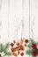 Christmas background with presents, fir branches and spices on the old wooden board with copy space