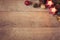 Christmas Background With Red Candles, Golden Cones And Sparkle Balls. Top View, Flat Lay. Winter Holidays Wooden Backdrop With