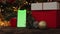 Christmas background red gift box smartphone gadget green screen blinking lights