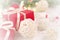 Christmas background, with red gift box and wicker white ball, on bokeh background