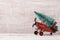 Christmas background with rustic vintage airplane toy and pine tree