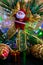 christmas background with Sana toy, branch, cones and gift, colorful bokeh selective focus