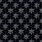 Christmas background Seamless pattern with white and blue snowflakes on a black background.
